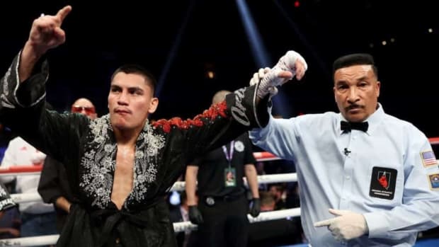 Vergil Ortiz Jr. has his hand raised by veteran boxing referee Tony Weeks.
